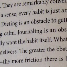 Close-up of text on a book page, with upscaling applied to enhance sharpness and readability of the typeface. before enhancement and upscaling