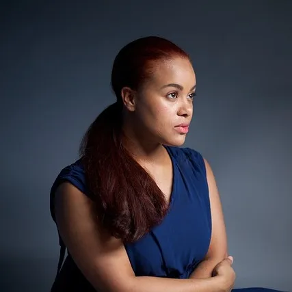 Portrait photo of a woman upscaled with identity and features fully preserved before enhancement and upscaling