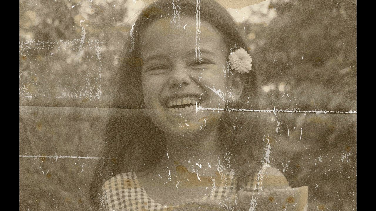 Restored portrait of a smiling girl using AI face restoration before enhancement and upscaling