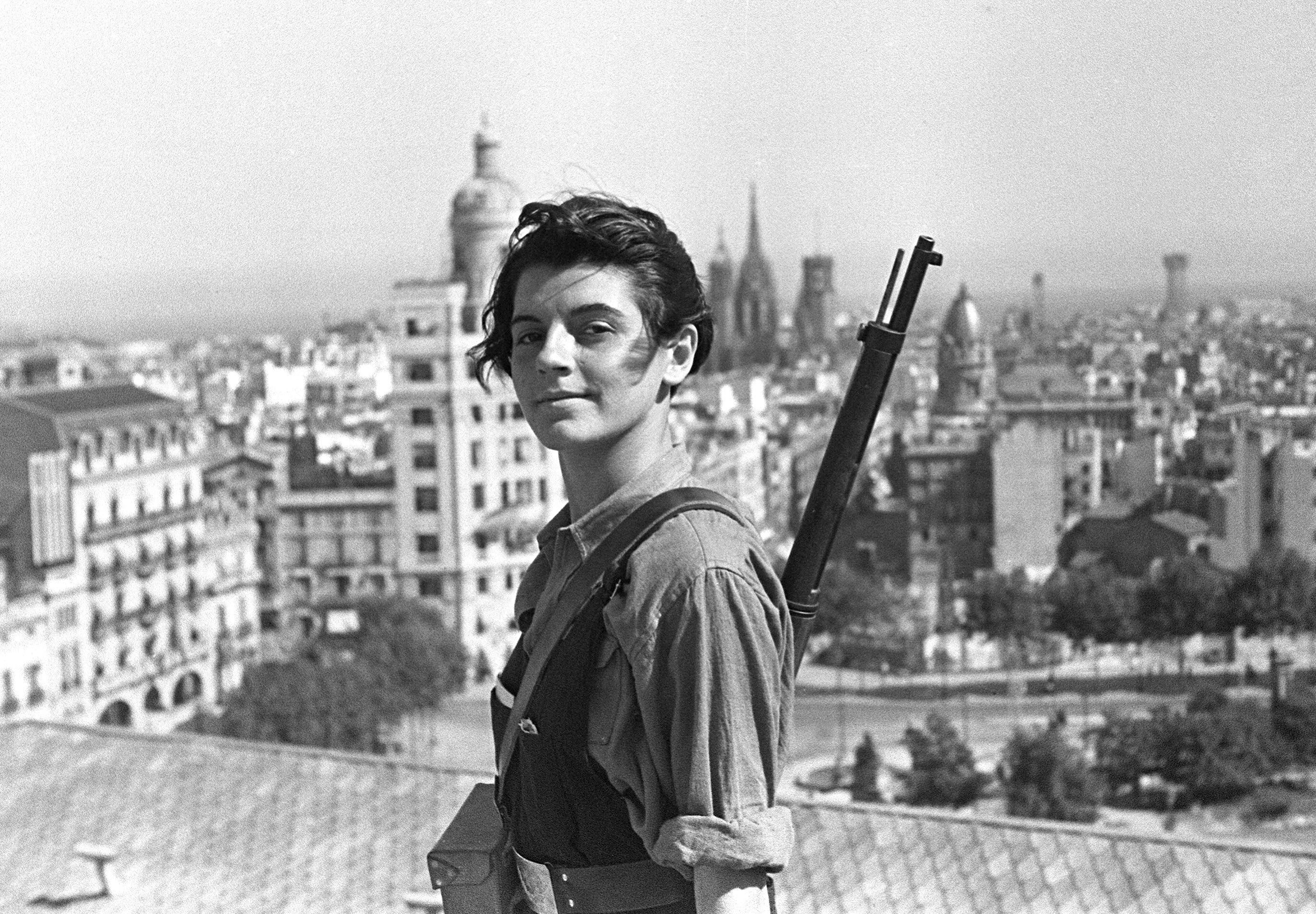 Marina Ginestà, a French communist militant, on a Barcelona rooftop with a rifle, symbolizing the anti-fascist struggle. before enhancement and upscaling