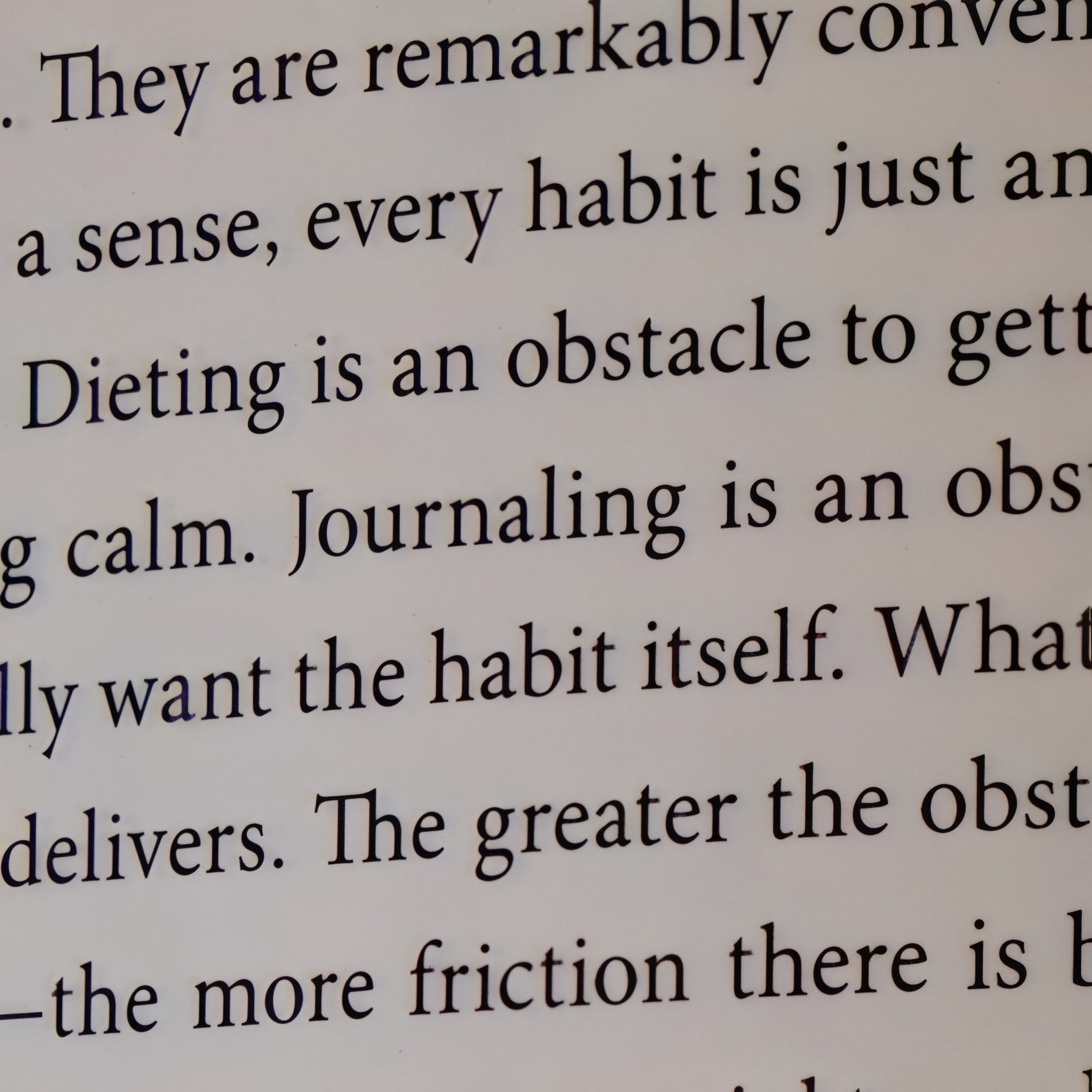 Close-up of text on a book page, with upscaling applied to enhance sharpness and readability of the typeface. after enhancement and upscaling