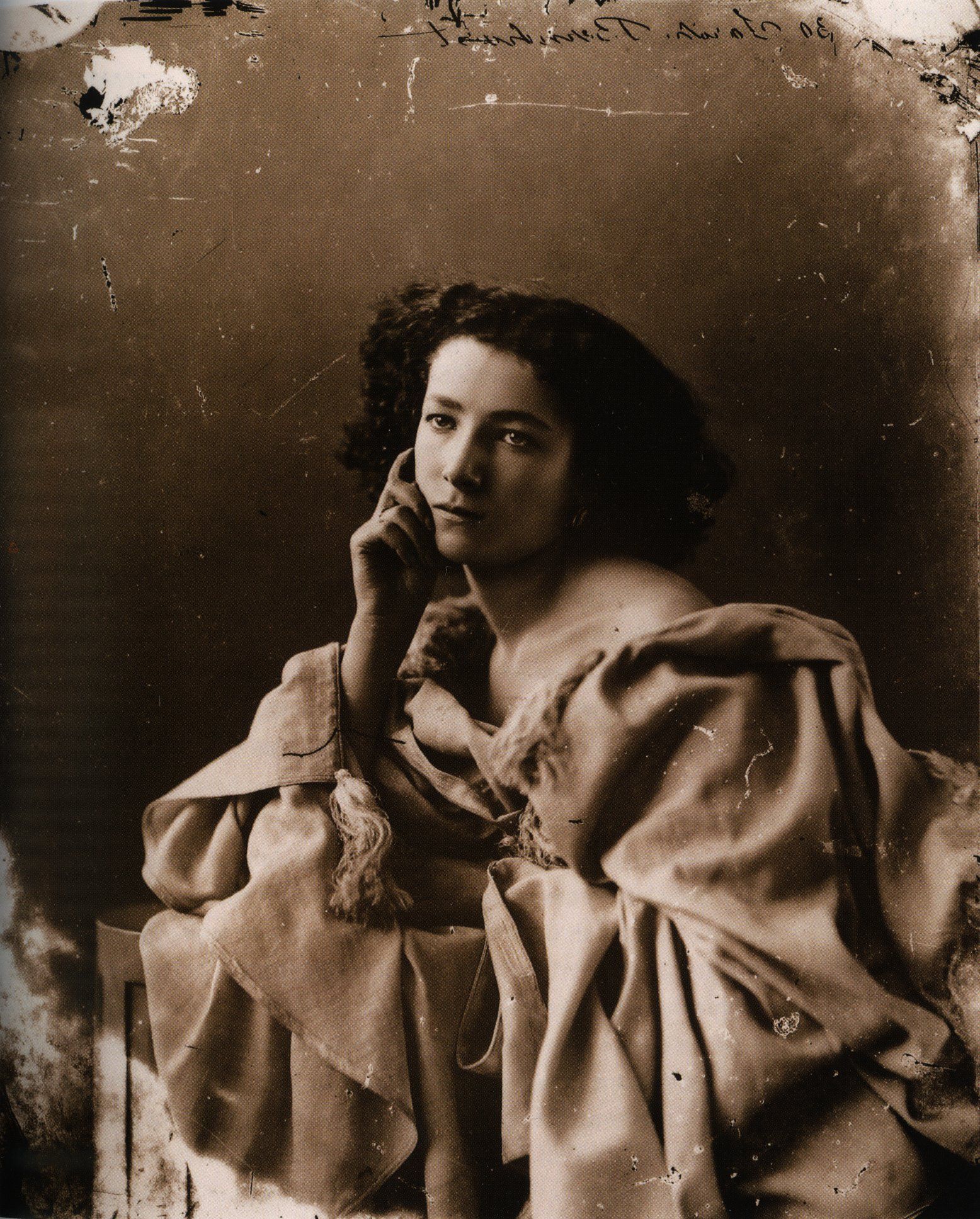 AI damage repair: A heavily faded and sepia-toned portrait of Sarah Bernhardt is restored to high quality. before enhancement and upscaling